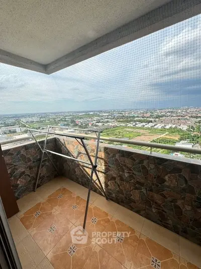 Stunning balcony view with tiled flooring and expansive cityscape