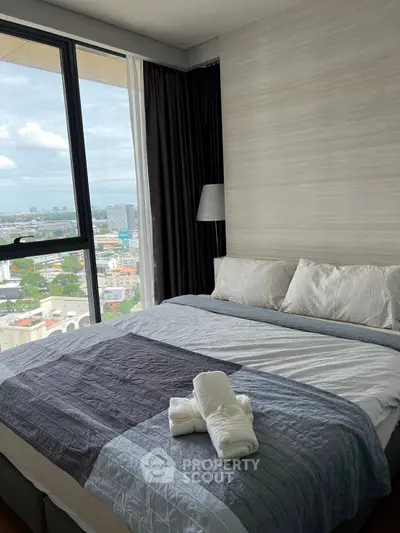 Luxurious bedroom with panoramic city view and elegant decor