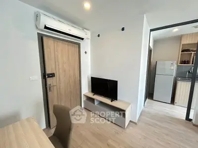 Modern apartment interior with air conditioning and compact kitchen
