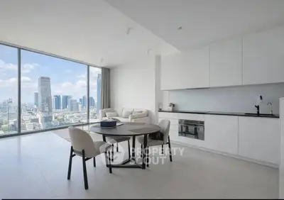Modern open-plan kitchen and living area with stunning city view