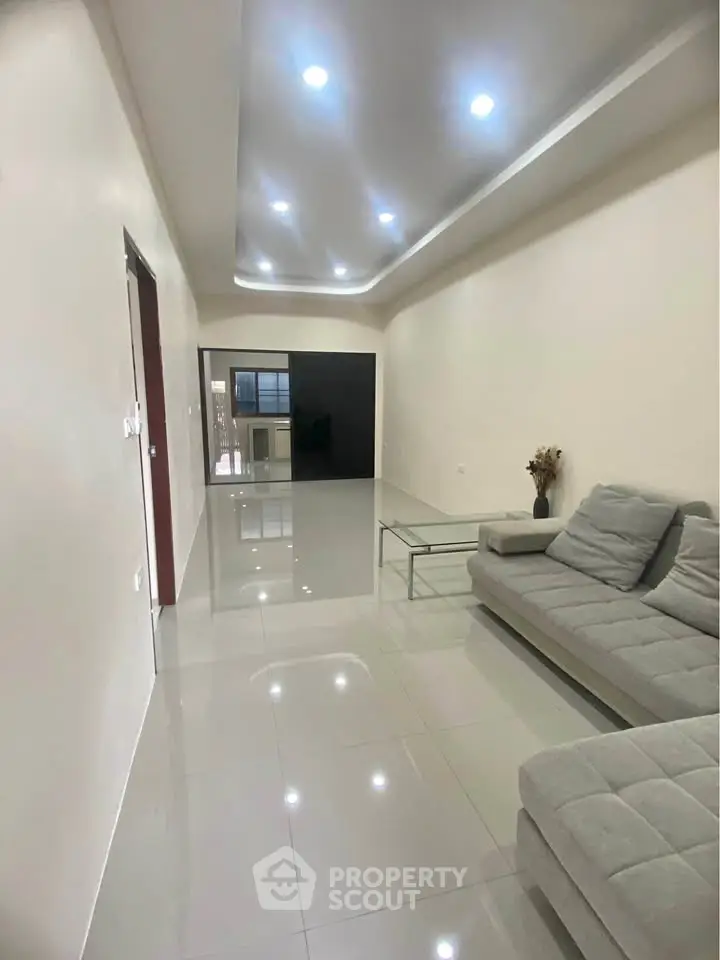 Spacious modern living room with sleek design and comfortable seating