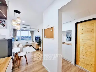 Modern open-plan living room with wooden flooring and stylish decor