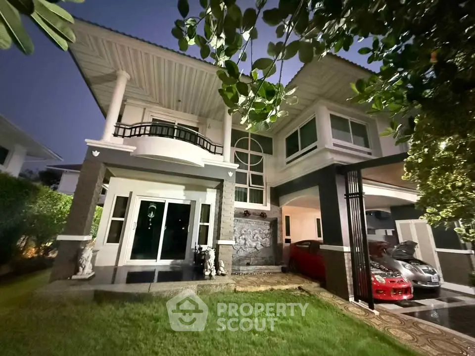 Stunning two-story house with modern architecture and spacious driveway, perfect for luxury living.