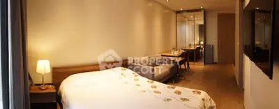 Modern bedroom with cozy sofa and elegant decor in a stylish apartment.