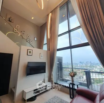 Luxurious high-ceiling living room with stunning city view and modern decor