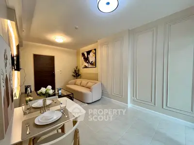 Modern living room with elegant decor and dining area