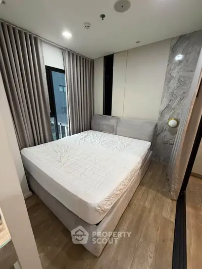 Modern bedroom with elegant design and cozy atmosphere in a stylish apartment.