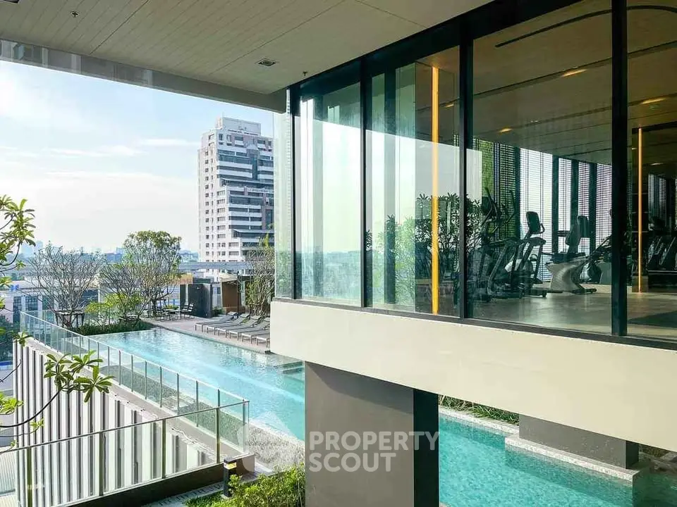 Luxurious condo with pool and gym overlooking cityscape