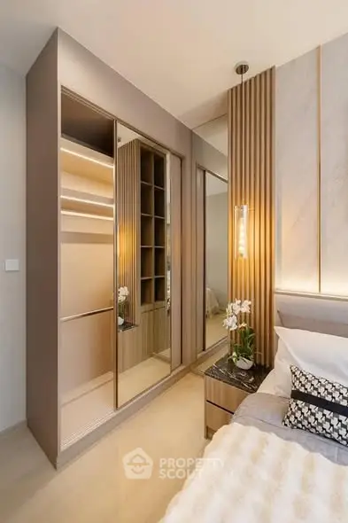 Modern bedroom with sleek wardrobe and elegant lighting