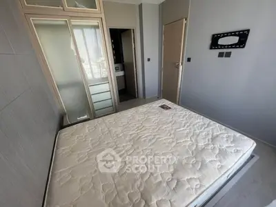 Modern bedroom with large mirror wardrobe and comfortable mattress