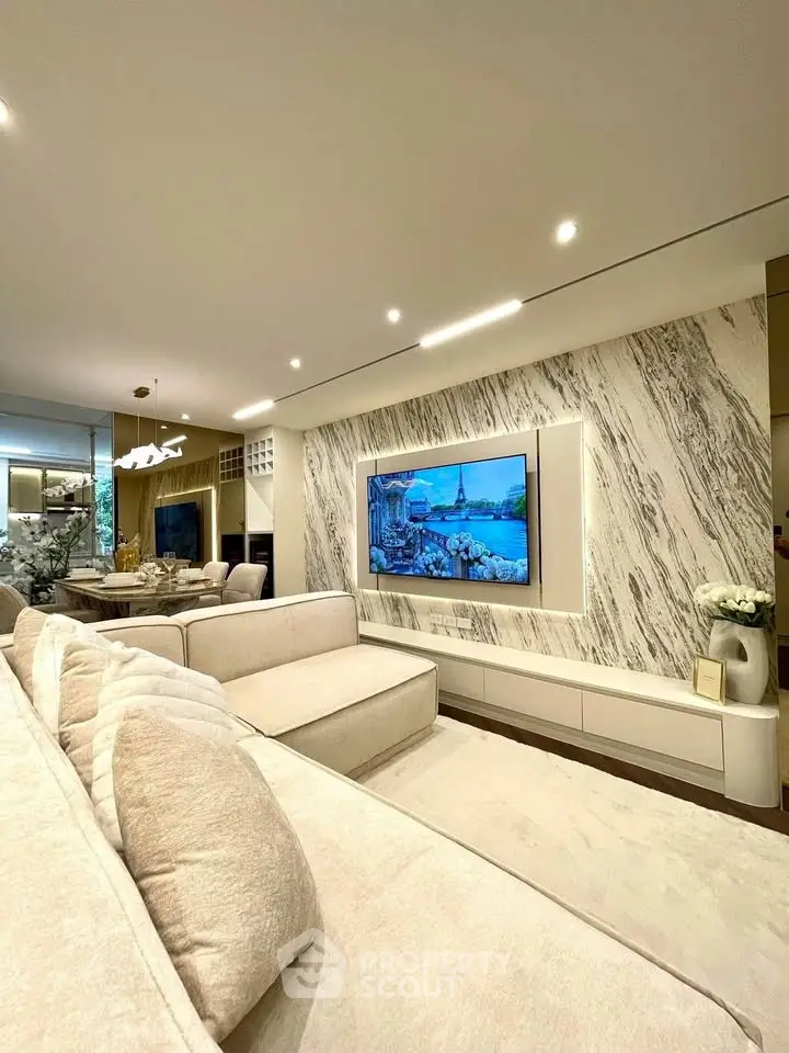 Luxurious living room with elegant marble wall and modern decor