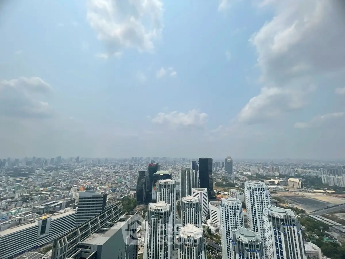 Stunning cityscape view from a high-rise building showcasing modern architecture and expansive skyline.