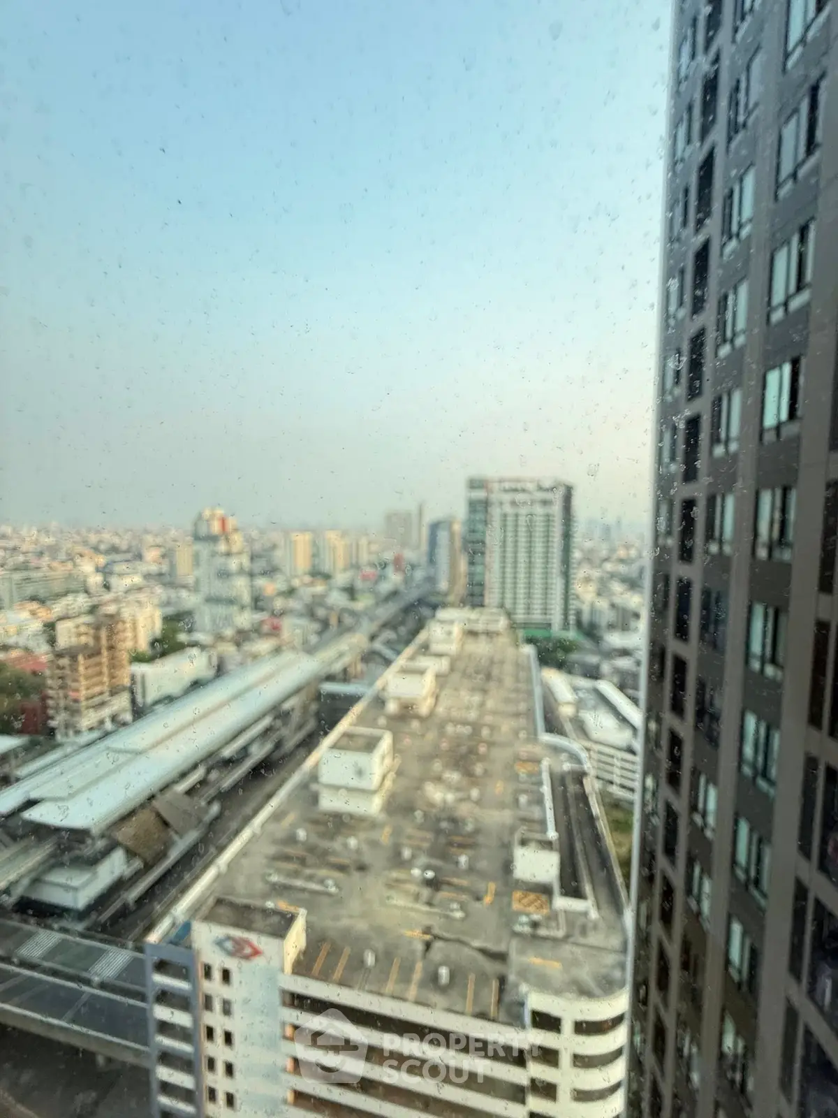Stunning cityscape view from high-rise building showcasing urban skyline and architectural marvels.