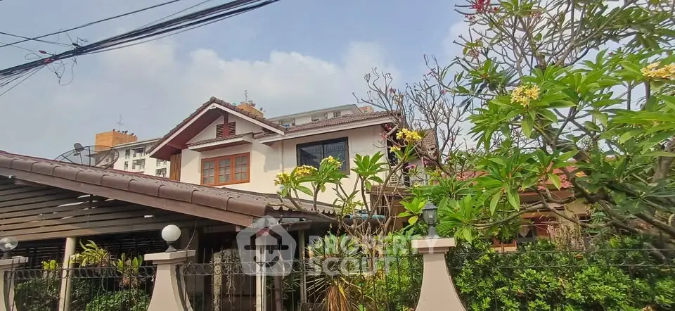 Charming suburban house with lush garden and classic architecture