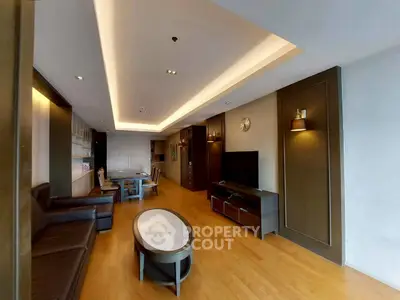 Spacious modern living room with elegant lighting and wooden flooring