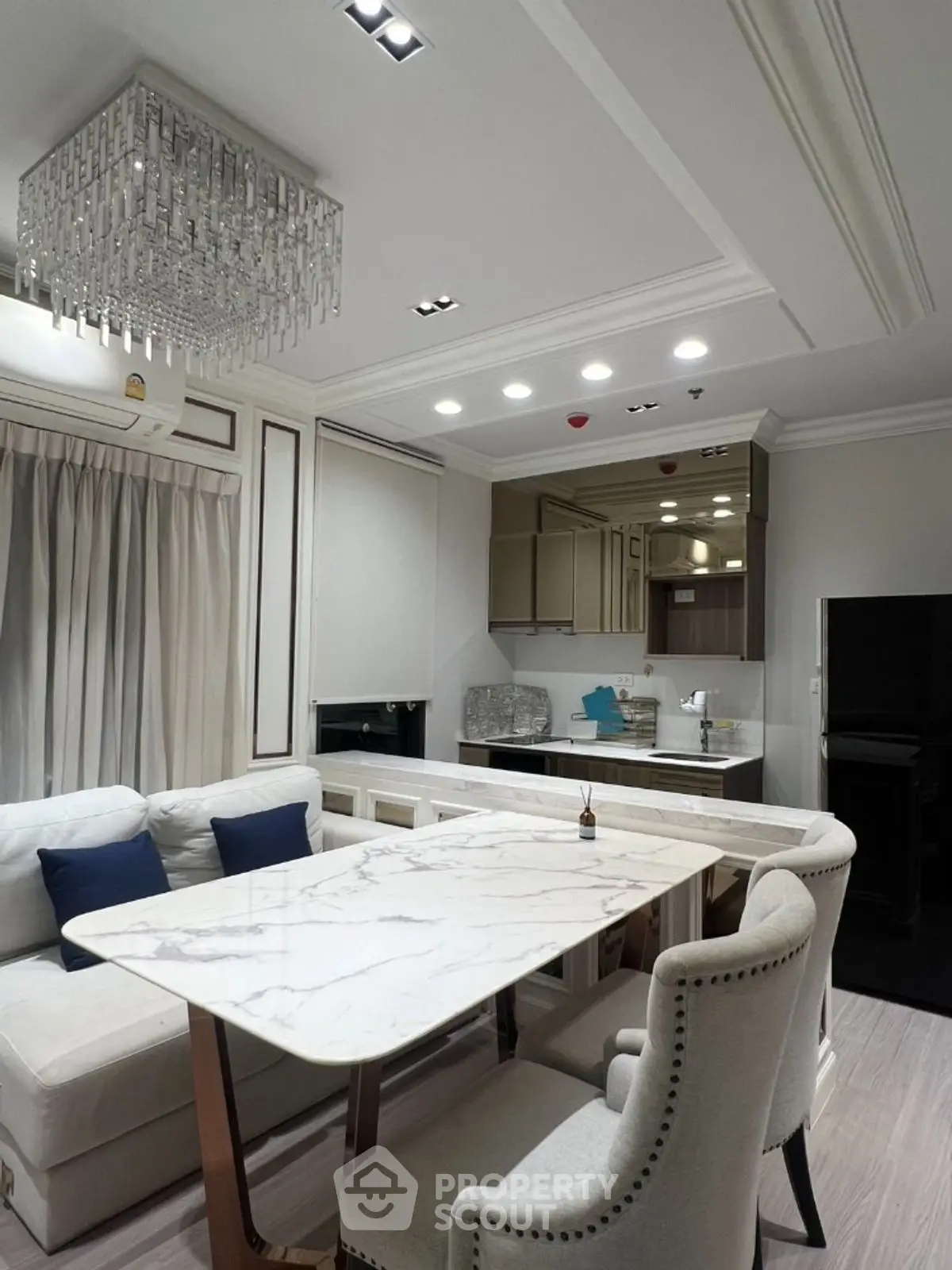 Luxurious modern living room with elegant dining area and stylish kitchen