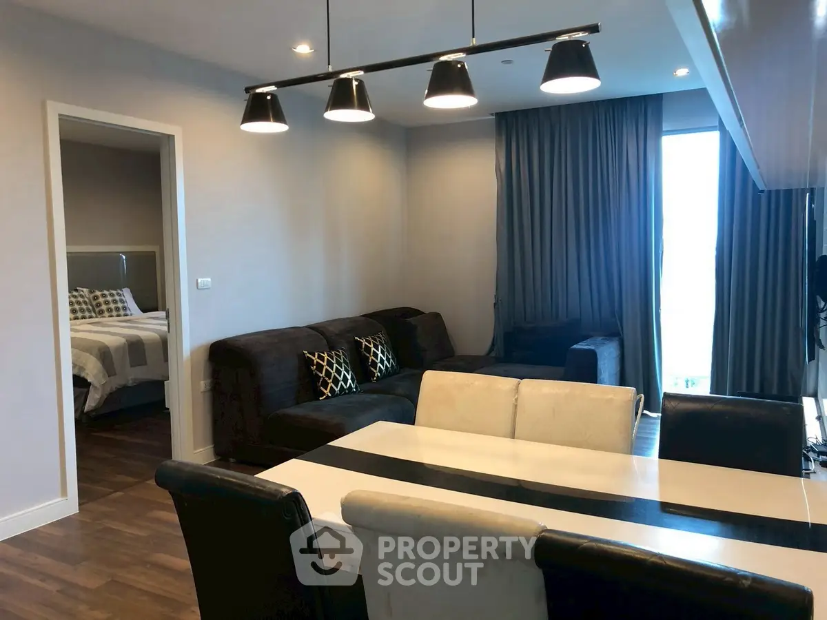 Modern living room with stylish lighting and cozy seating area