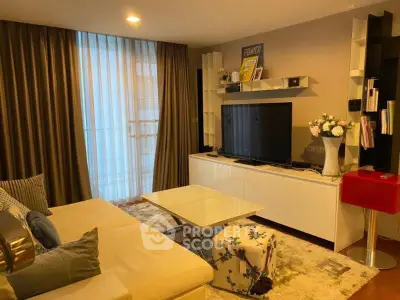 Stylish living room with modern decor, cozy seating, and entertainment center.