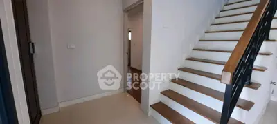 Modern interior with sleek staircase and hallway in contemporary home