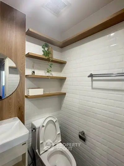 Modern bathroom with white subway tiles and wooden shelves