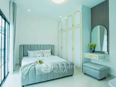 Luxurious bedroom with elegant decor and large windows for natural light