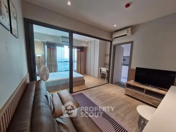 Modern apartment interior with cozy living room and bedroom view