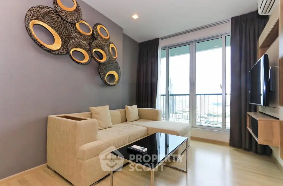 Modern living room with stylish decor and city view balcony in luxury apartment.