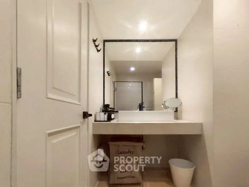 Modern bathroom with large mirror and stylish sink area