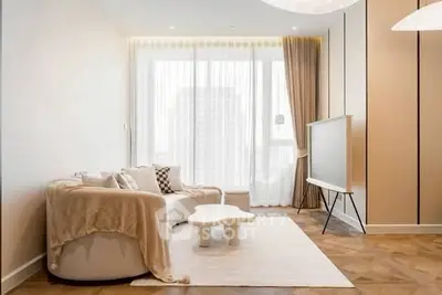 Modern living room with elegant decor and large window view