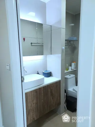 Modern bathroom with sleek design and wooden vanity