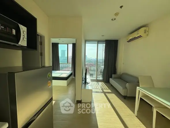 Modern apartment with open living area and balcony view