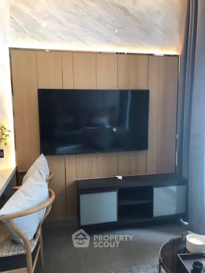 Modern living room with sleek TV setup and stylish furniture