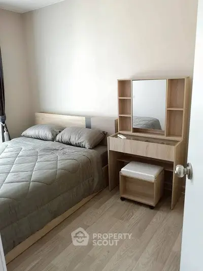 Cozy bedroom with modern wooden furniture and soft bedding