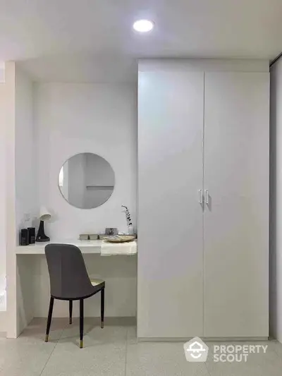 Minimalist bedroom with sleek wardrobe and stylish vanity area