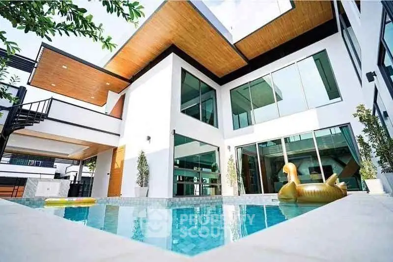 Luxurious modern home with stunning pool and sleek architectural design.