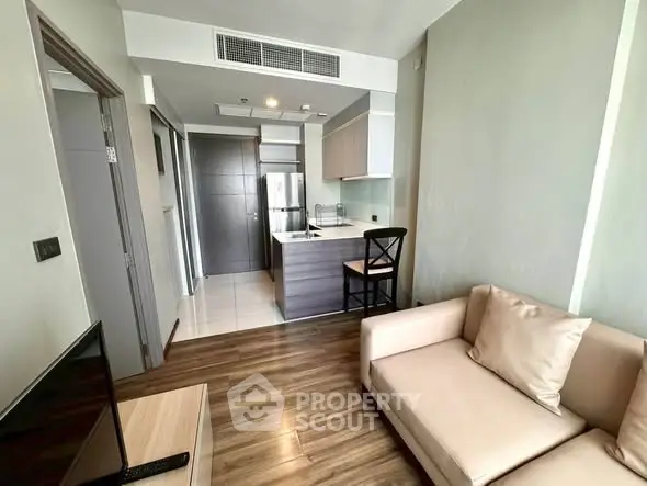 Modern apartment interior with cozy living room and open kitchen layout