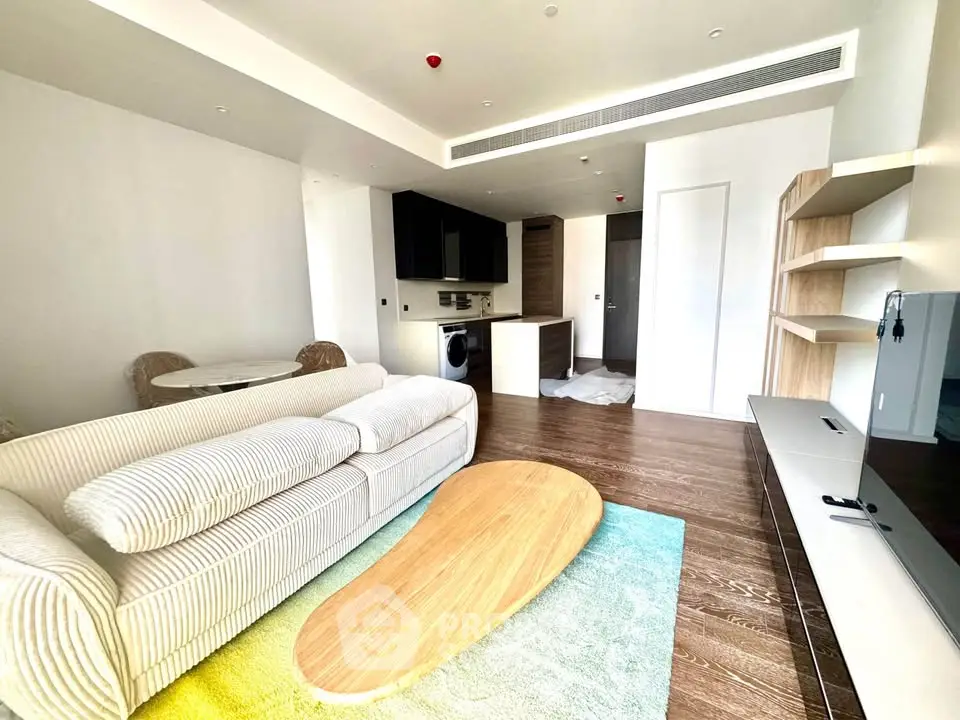 Modern living room with stylish furniture and open kitchen layout