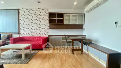 Modern living room with red sofa and stylish decor