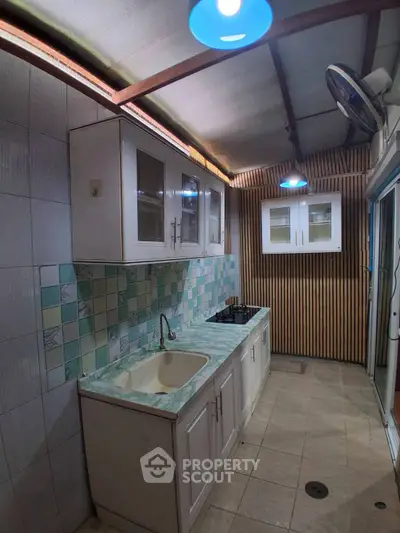 Charming kitchen with closed layout and modern cabinetry, perfect for culinary enthusiasts.