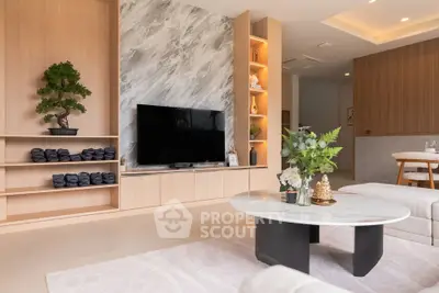 Modern living room with stylish decor and large TV in elegant apartment