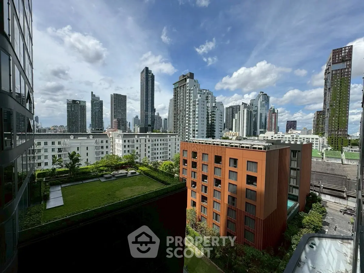 Stunning cityscape view with modern high-rise buildings and lush green rooftop garden.