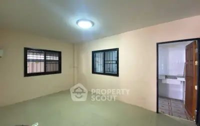 Spacious unfurnished room with tiled floor and natural light