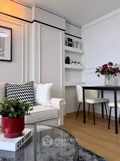 Stylish modern living room with elegant decor and cozy seating area.