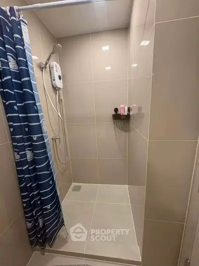 Modern bathroom with sleek shower and stylish curtain in a contemporary home.