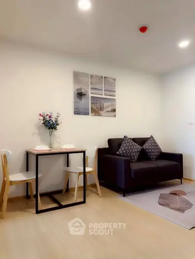 Modern living room with cozy sofa and dining area in stylish apartment