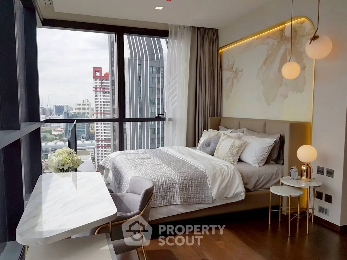 Luxurious bedroom with city view, modern decor, and elegant lighting in high-rise apartment.