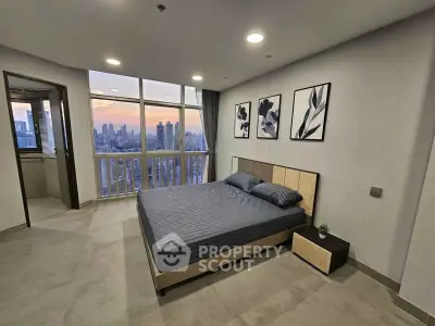Modern bedroom with stunning city view and elegant decor