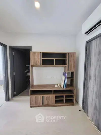 Modern minimalist study room with wooden shelving and air conditioning
