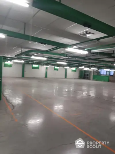 Spacious underground parking area with ample lighting and marked spaces