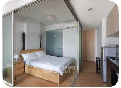 Modern studio apartment with glass partitions and minimalist decor
